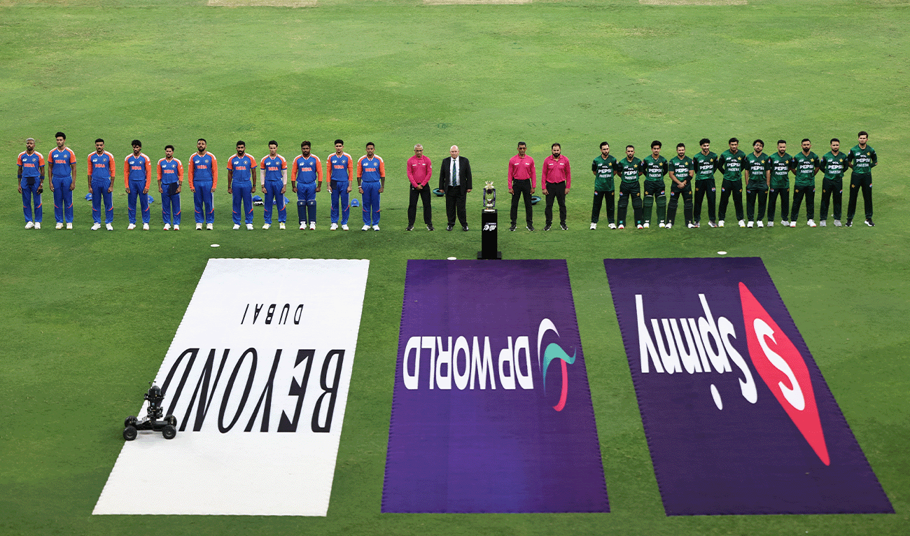 India's (left) and Pakistan's players stand for their national anthems before the start of the Asia Cup 2025 Twenty20 international cricket match between India and Pakistan at the Dubai International Stadium in Dubai on September 14, 2025. (AFP/File)