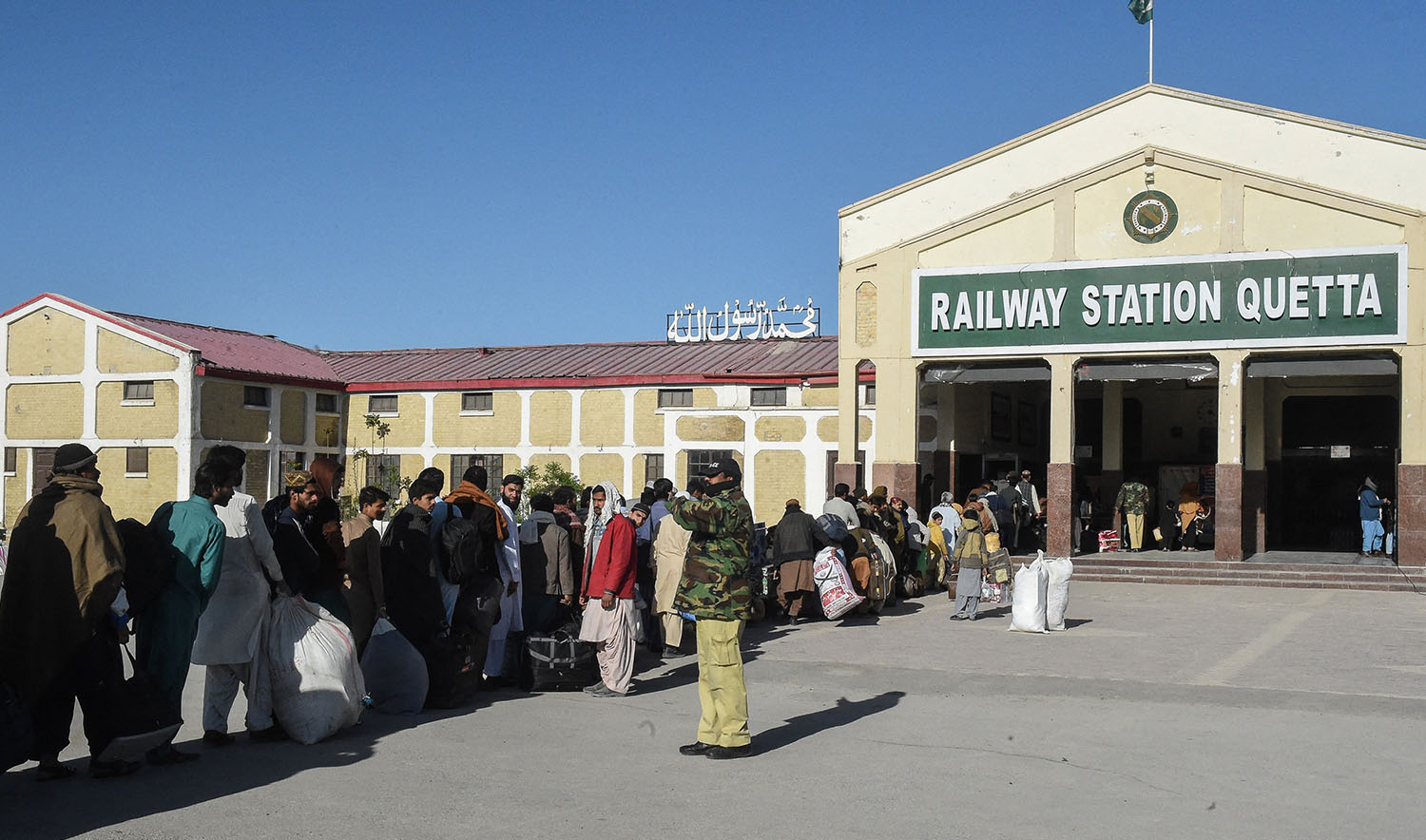 Passengers stand in a queue as they wait to enter Quetta railway station as the Jaffar Express train resumes its services after an attack by ethnic Baloch separatists earlier this month in Quetta on March 28, 2025. (AFP/ file)