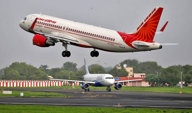 An Air India Airbus A320-200 aircraft takes off as an IndiGo Airlines aircraft waits for clearance at the Sardar Vallabhbhai Patel International Airport in Ahmedabad, India, on July 7, 2017. (REUTERS/File)