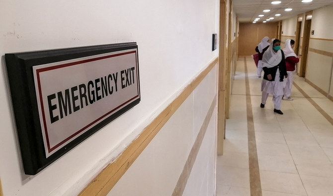 Medical staff members prepare rooms in an isolation ward at the Pakistan Institute of Medical Sciences hospital in Islamabad on January 31, 2020. (AFP/File)