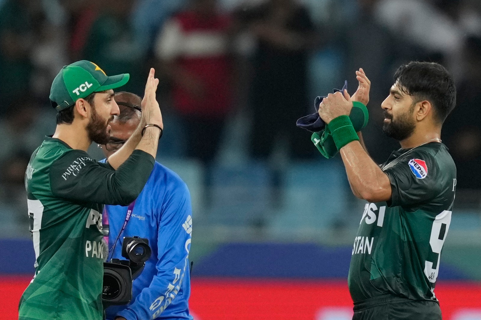 Pakistan’s captain Salman Agha, left, and Pakistan’s Haris Rauf celebrate after Pakistan won during the Asia Cup cricket match between Bangladesh and Pakistan at Dubai International Cricket stadium in Dubai, United Arab Emirates on September 25, 2025. (AP)