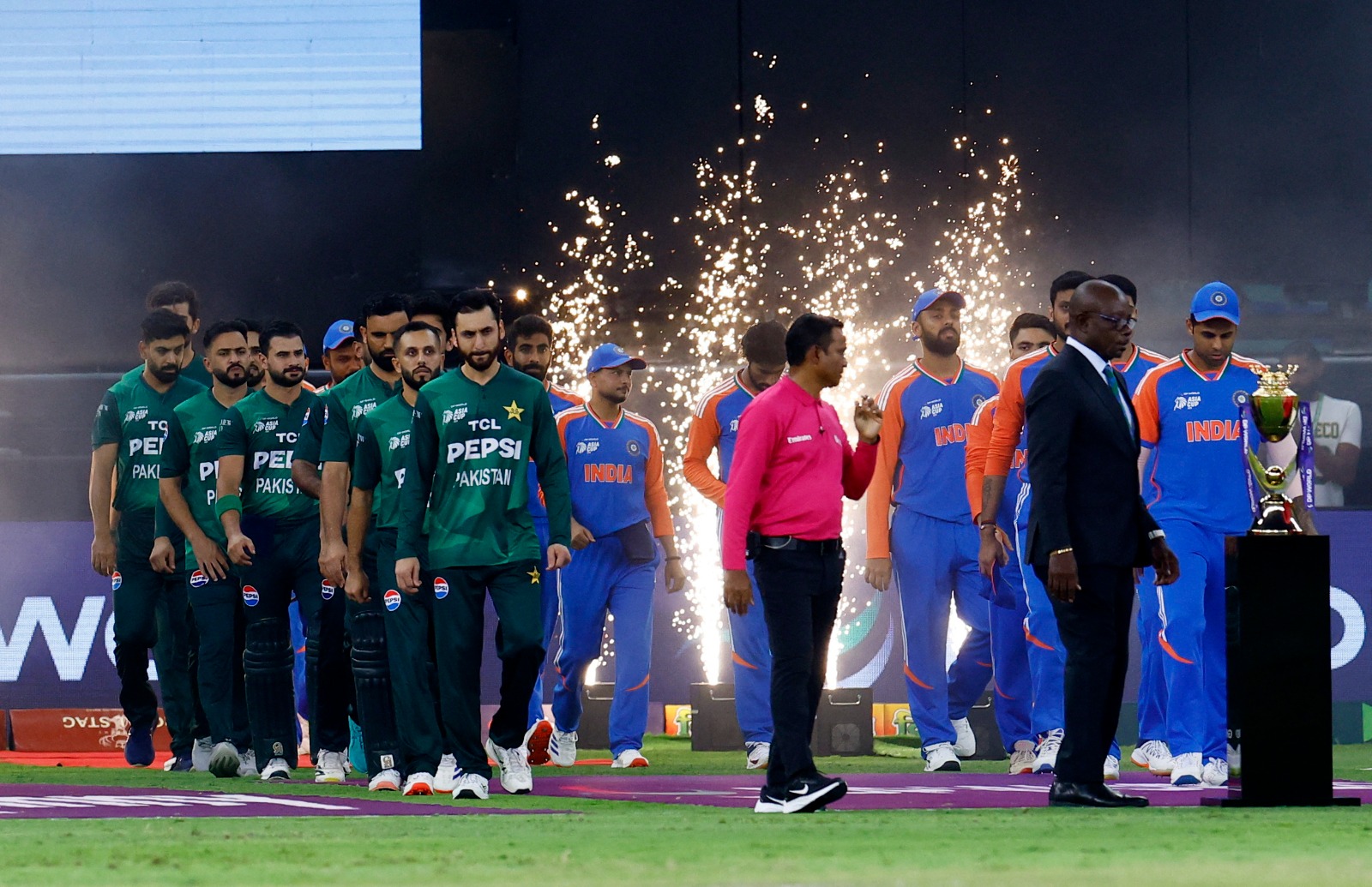 Pakistan and India players walk out before the start of the Asia Cup final between India and Pakistan at the Dubai International Cricket Stadium in Dubai, UAE on September 28, 2025 (REUTERS)