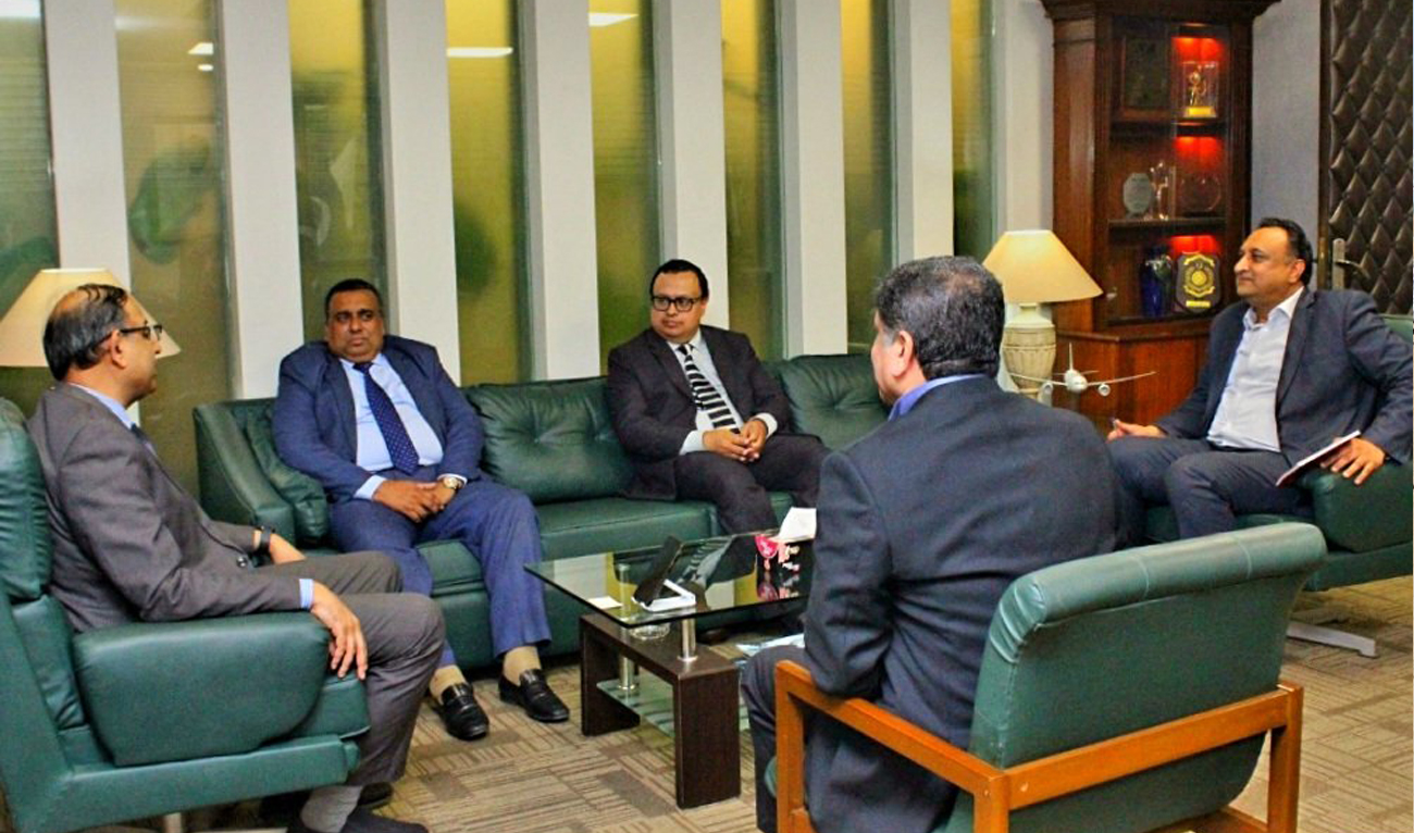 Bangladesh High Commissioner to Pakistan Iqbal Hussain Khan speaks during a meeting with the Pakistan International Airlines (PIA) head office in Karachi on September 28, 2025. (Handout/PIA)