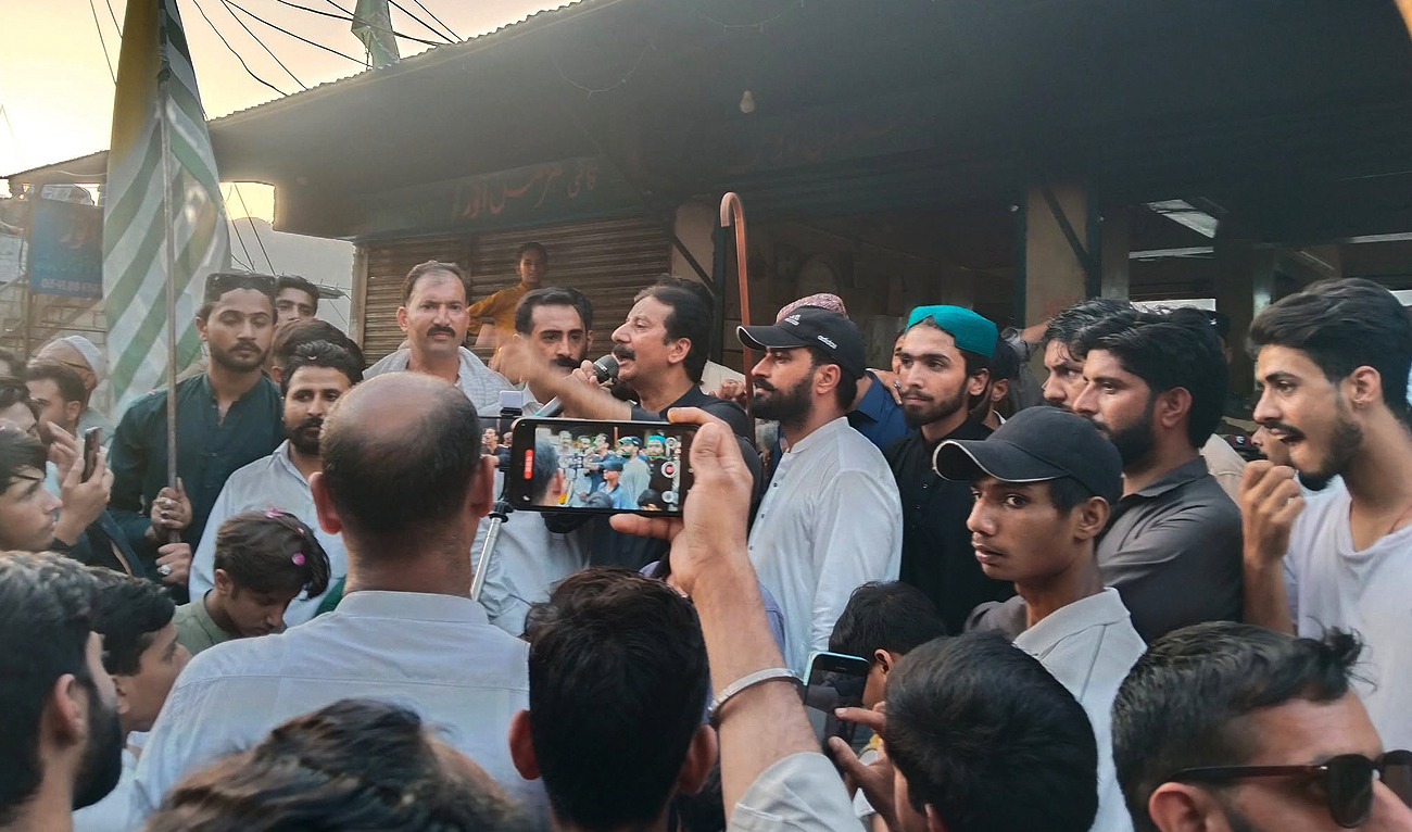 Shaukat Nawaz Mir, Member of Jammu Kashmir Joint Awami Action Committee, addresses protesters during a rally in Muzaffarabad, Azad Kashmir on September 27, 2025. (Photo courtesy: Facebook/Shaukat Nawaz Mir)