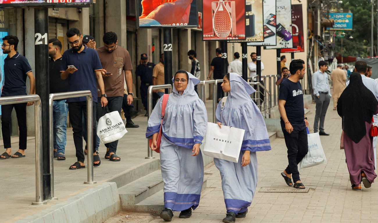 People walk outside shopping mall in Karachi, Pakistan on September 23, 2025. (REUTERS/File)