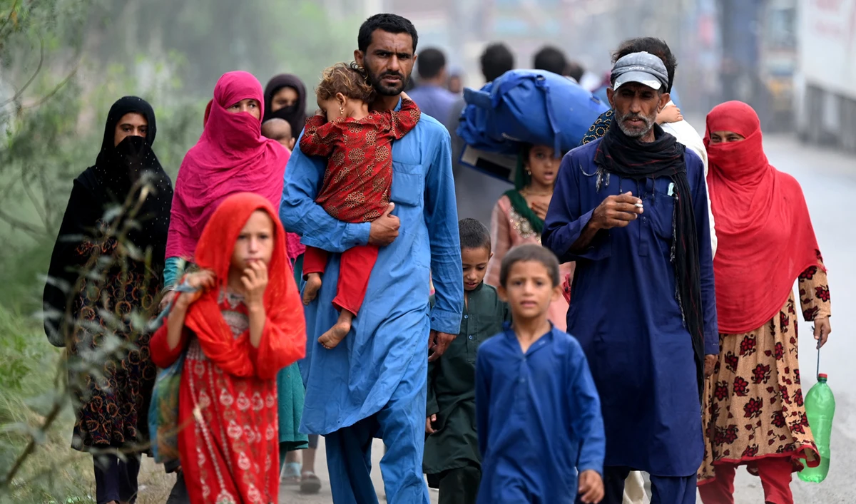 Afghan refugees arrive at the UNHCR repatriation center in Azakhel, Khyber Pakhtunkhwa province on August 23, 2025. (AFP/File)