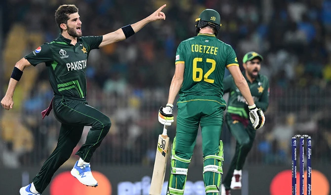 Pakistan’s Shaheen Shah Afridi (left) celebrates after taking the wicket of South Africa’s Gerald Coetzee (center) during the 2023 ICC Men’s Cricket World Cup one-day international (ODI) match at the MA Chidambaram Stadium in Chennai on October 27, 2023. (AFP/File)
