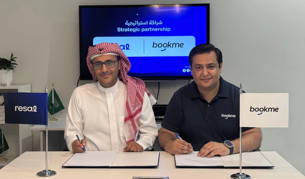 The photograph taken on September 4, 2025, shows founder of Pakistani startup Bookme, Faizan Aslam (right), and Co-founder of Resal, Hatem Kameli, signing an agreement in Riyadh, Saudi Arabia. (Courtesy: Bookme)