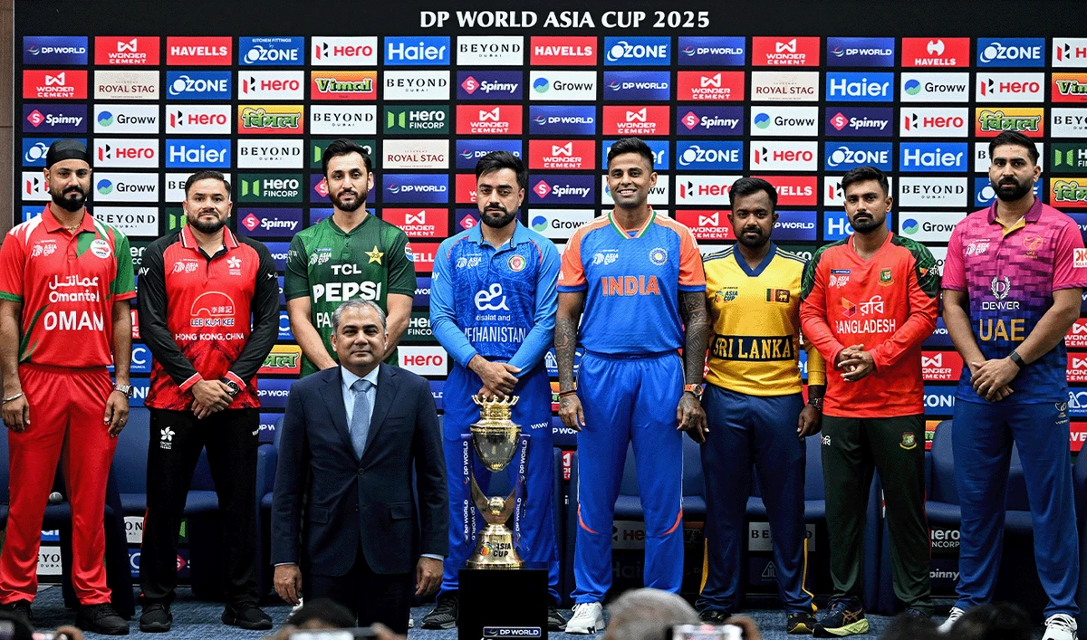 Captains of participating teams (L-R) Oman's Jatinder Singh, Hong Kong's Yasim Murtaza, Pakistan's Salman Agha, Afghanistan's Rashid Khan, India's Suryakumar Yadav, Sri Lanka's Charith Asalanka, Bangladesh's Litton Das and UAE's Muhammad Waseem pose with the Asia Cup 2025 Twenty20 international cricket match trophy alongside Asian Cricket Council (ACC) president Mohsin Naqvi during a press conference at the Dubai International Stadium in Dubai on September 9, 2025. (AFP/File)