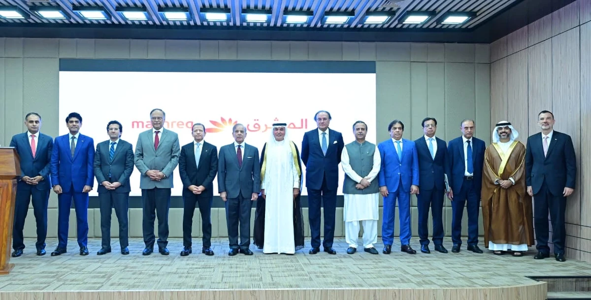 Mashreq Bank officials gesture for a group photograph with Pakistan Prime Minister during the launching of its digital banking services in Islamabad on September 16, 2025. (Handout/Mashreq Bank)