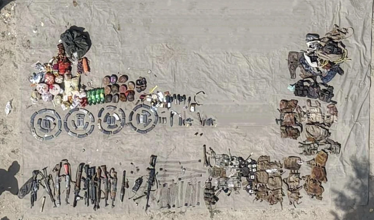 This handout photo, released by Pakistan’s Inter-Services Public Relations on September 27, 2025, shows weapons and ammunition recovered from militants following an intelligence based operation in Lakki Marwat district, Khyber Pakhtunkhwa. (Handout/ISPR)