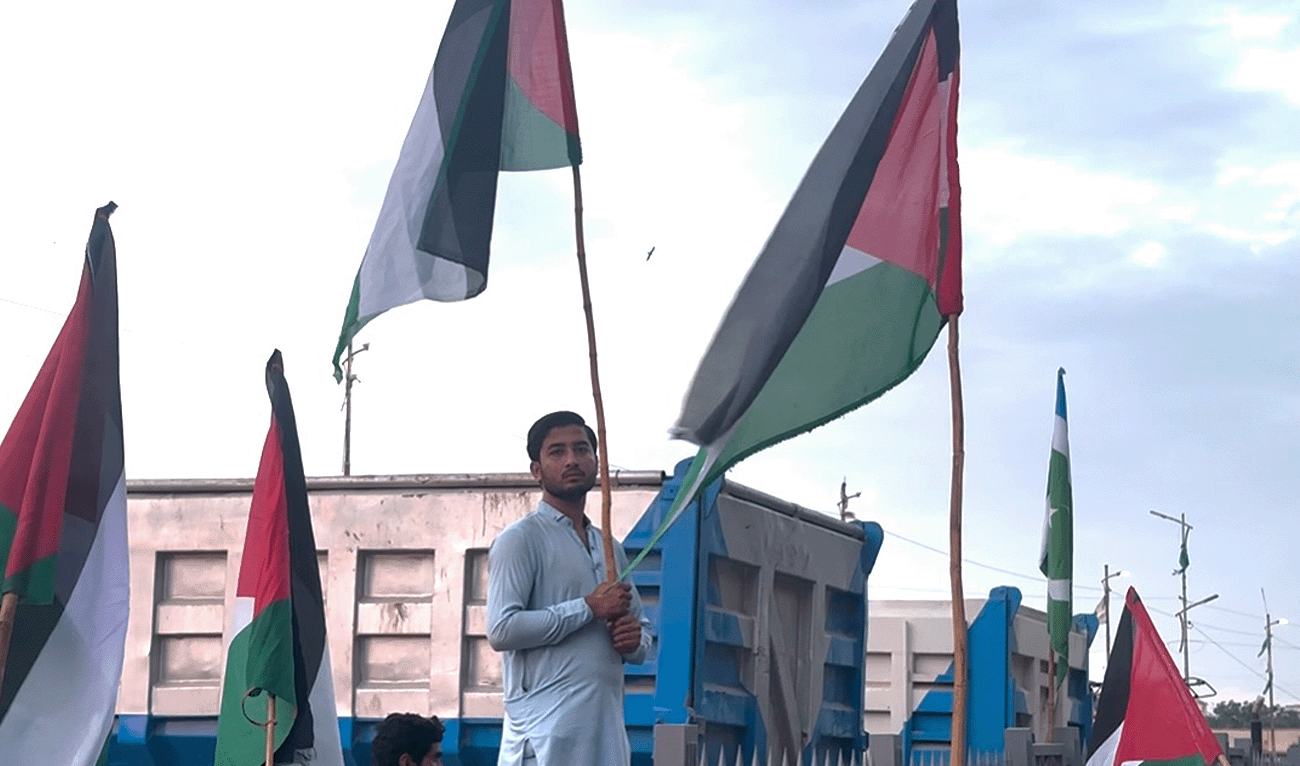 A protestor holding flag of Palestine during a protest in Karachi, Pakistan, on October 2, 2025, against interception of Global Sumud Flotilla by Israel. (AN Photo)