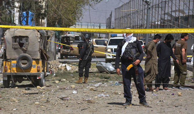 Security officials examine damaged vehicles at the site of a powerful car bombing, in Quetta, Pakistan, on September 30, 2025. (AP)