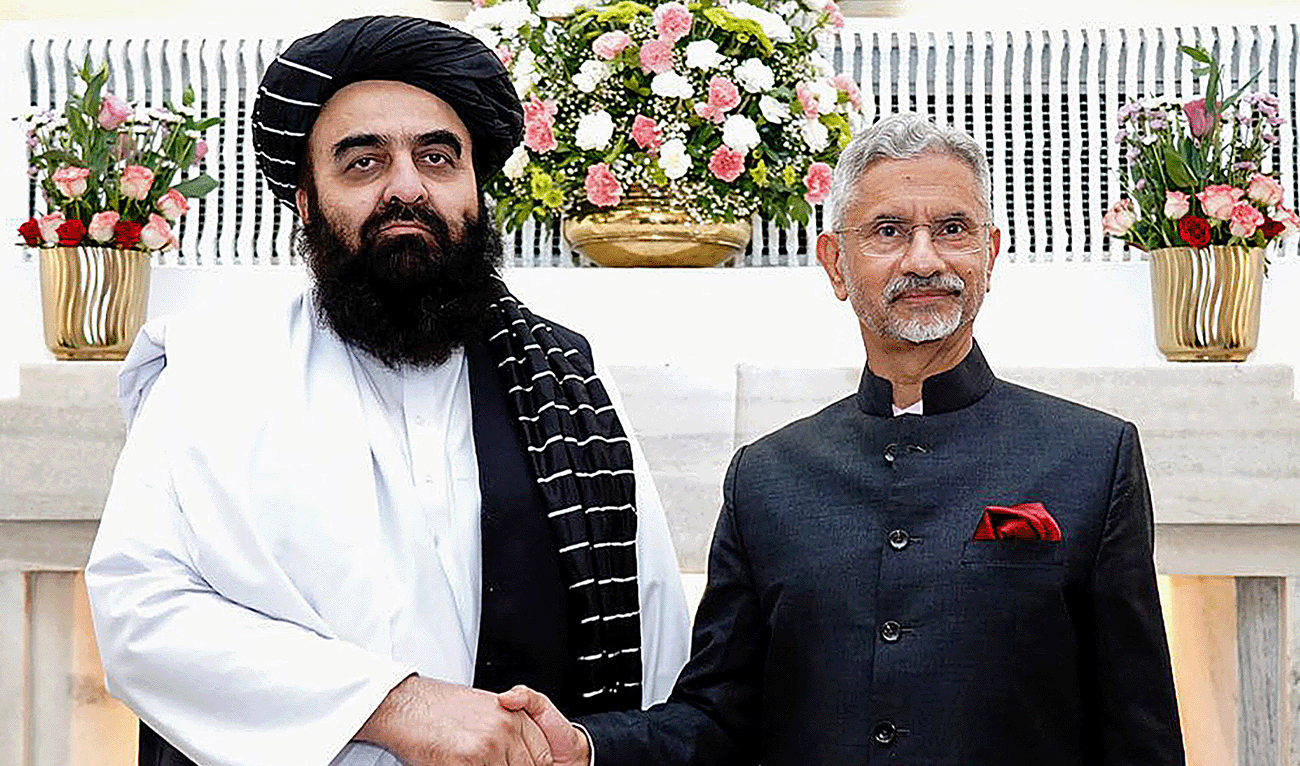 This handout photograph taken and released by India's Ministry of External Affairs on October 10, 2025 shows India's Foreign Minister Subrahmanyam Jaishankar (R) and his Afghan counterpart Amir Khan Muttaqi shaking hands during a bilateral meeting in New Delhi, India. (AFP/File)