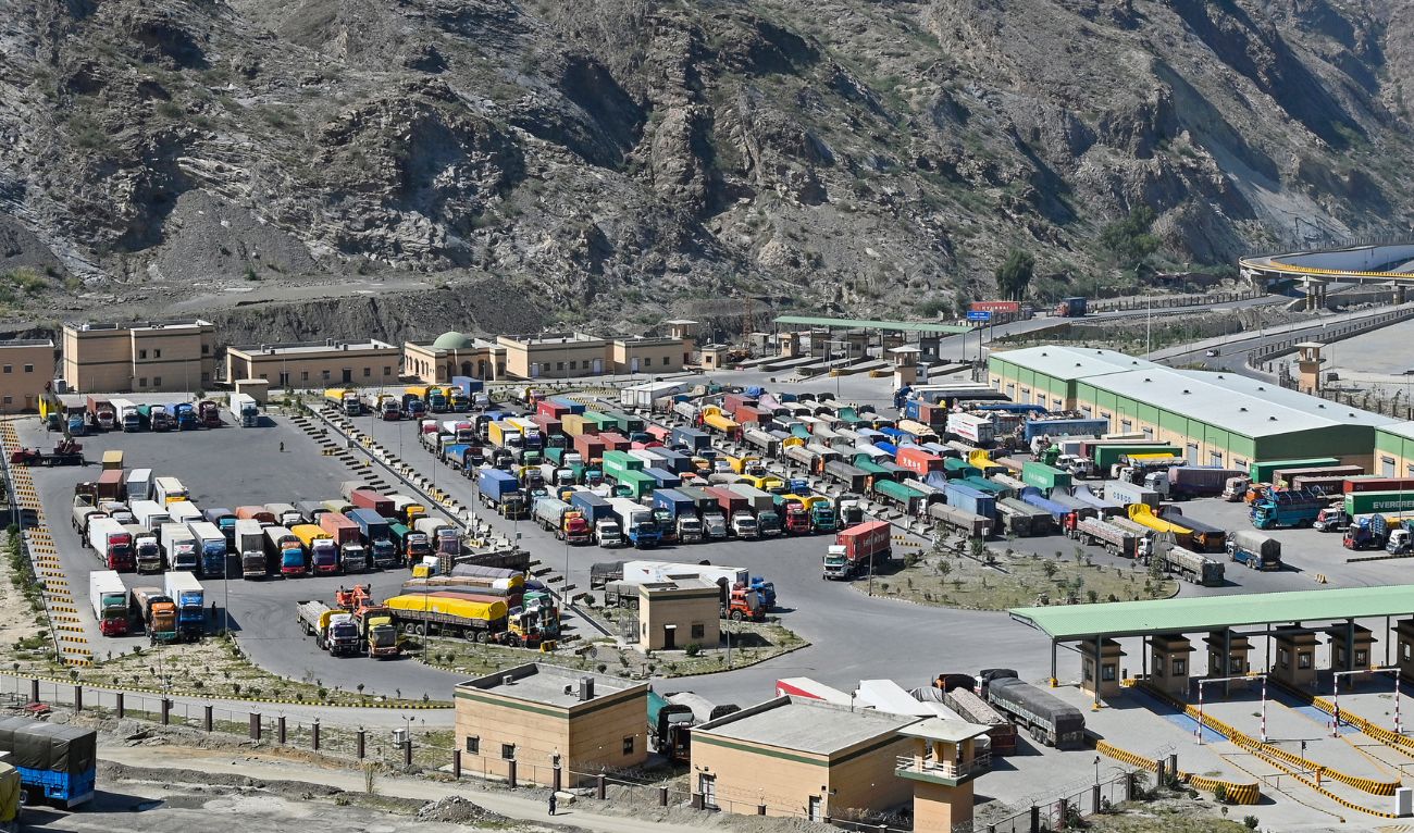 Trucks remain stalled at the Pakistan-Afghanistan border town of Torkham on October 13, 2025, amid cross-border clashes between the two countries. (AFP)