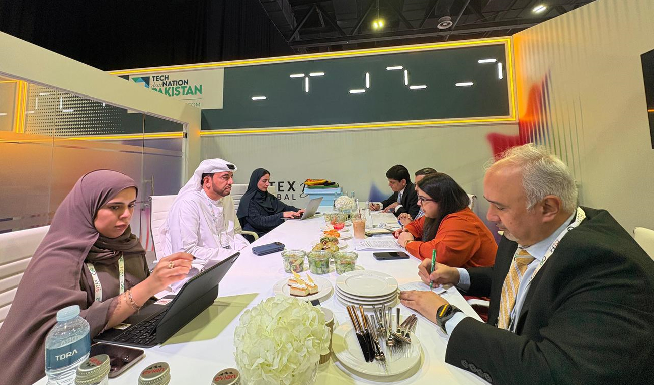 The handout photograph released on October 14, 2025, shows Pakistan’s Federal Minister for IT and Telecom, Shaza Fatima Khawaja (second right), meeting with Omar Suwaina Al Suwaidi (second left), Undersecretary at the UAE Ministry of Industry and Advanced Technology, on the sidelines of GITEX 2025, in Dubai, UAE. (Ministry of IT and Telecom)