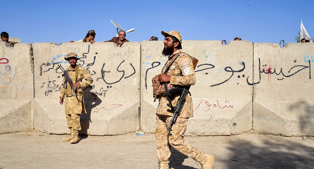 Armed Taliban security personnel keep guard near the closed gate of the zero point border crossing between Afghanistan and Pakistan at Spin Boldak district in Kandahar province on October 12, 2025. (AFP)
