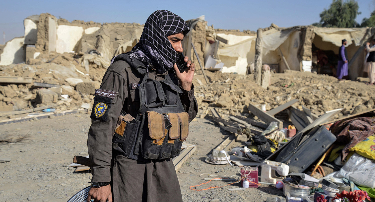 A Taliban security personnel stands near a damaged house in the Spin Boldak district of Kandahar province on October 16, 2025, a day after the cross-border clashes between Afghanistan and Pakistan. (AFP)