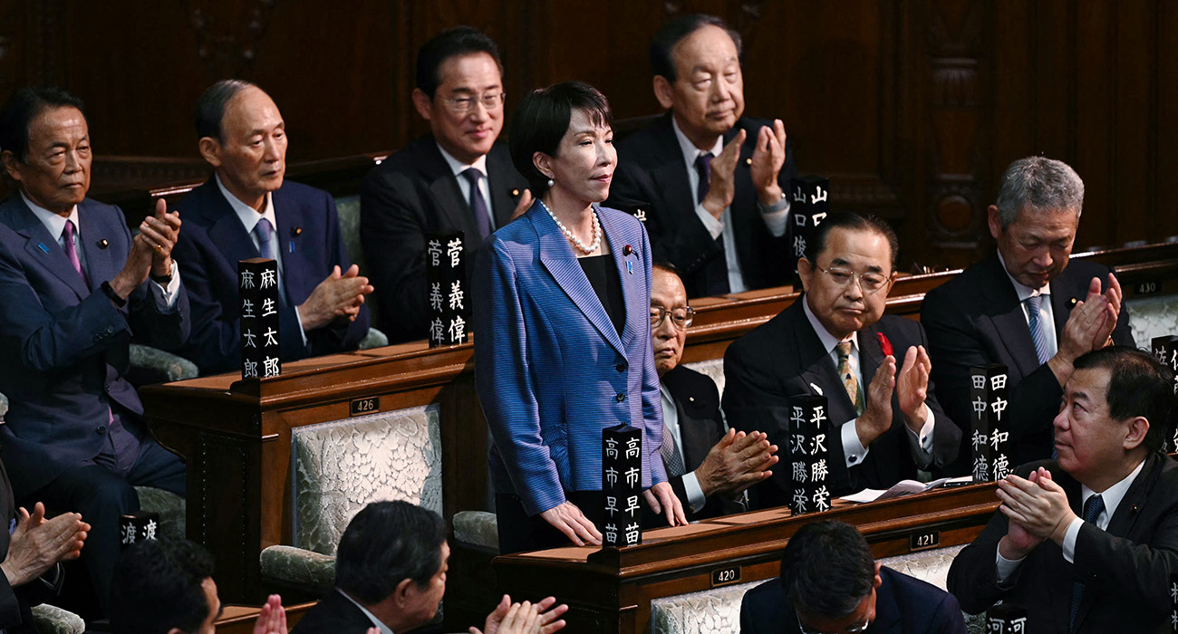 Liberal Democratic Party (LDP) President Sanae Takaichi stands up to acknowledge the applause after she was selected as Japan's new prime minister during an extraordinary session of the lower house of parliament in Tokyo on October 21, 2025. (AFP)