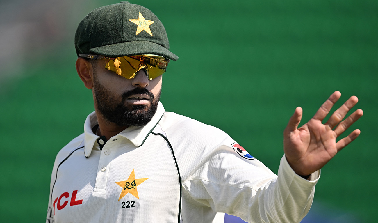 Pakistan's Babar Azam gestures during the second day of the first Test cricket match between Pakistan and South Africa at the Gaddafi Stadium in Lahore on October 13, 2025. (AFP)