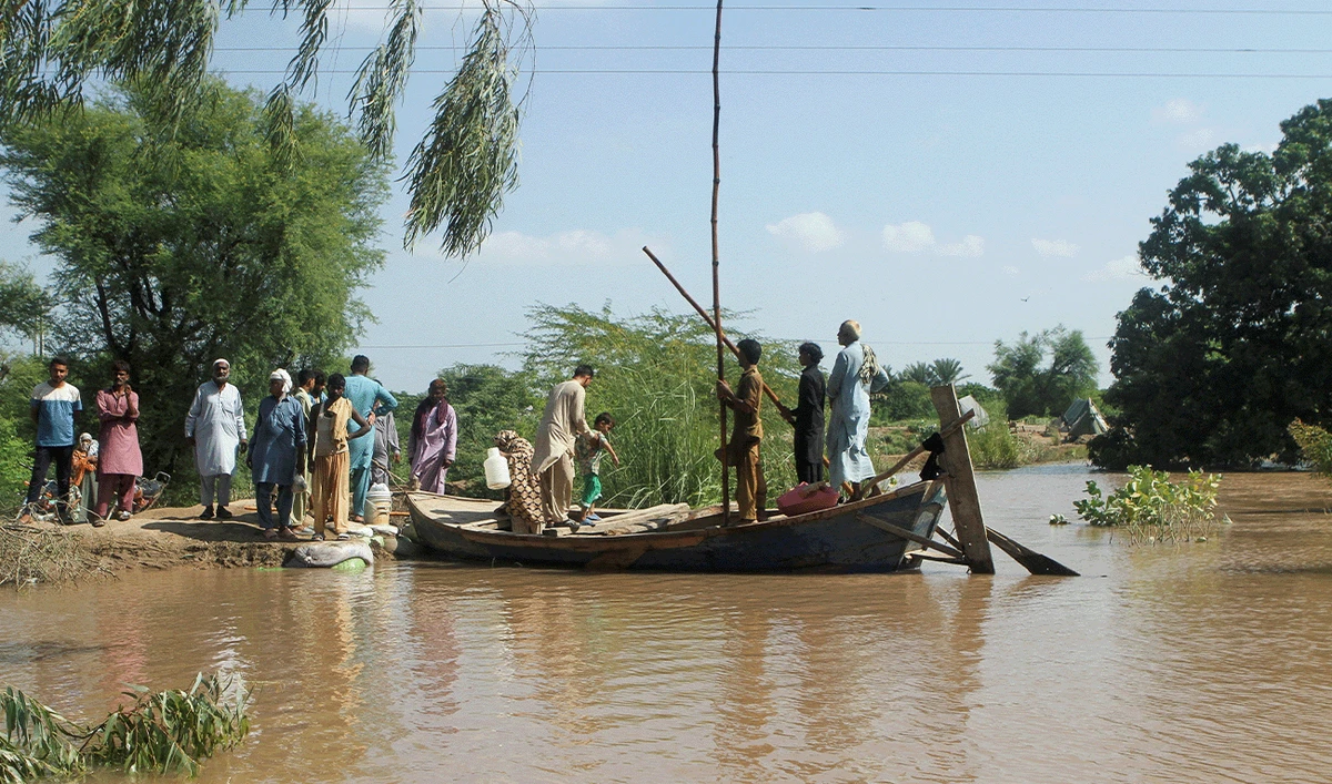 Residents board a boat while other wait for Rescue 1122 boat as they evacuate from the flooded area, following monsoon rains and rising water levels of the Chenab River, in Qasim Bela village on the outskirts of Multan in Punjab province, Pakistan, September 11, 2025. (Reuters/File)