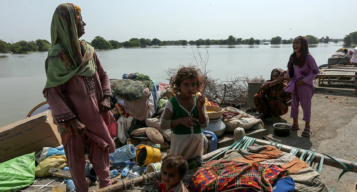 A flood-affected family gathers in a safer place near a closed motorway damaged by floodwater in Jalalpur Pirwala, in the Multan district of Punjab province on September 17, 2025, after the Chenab River overflowed following heavy monsoon rains. (AFP/ file)