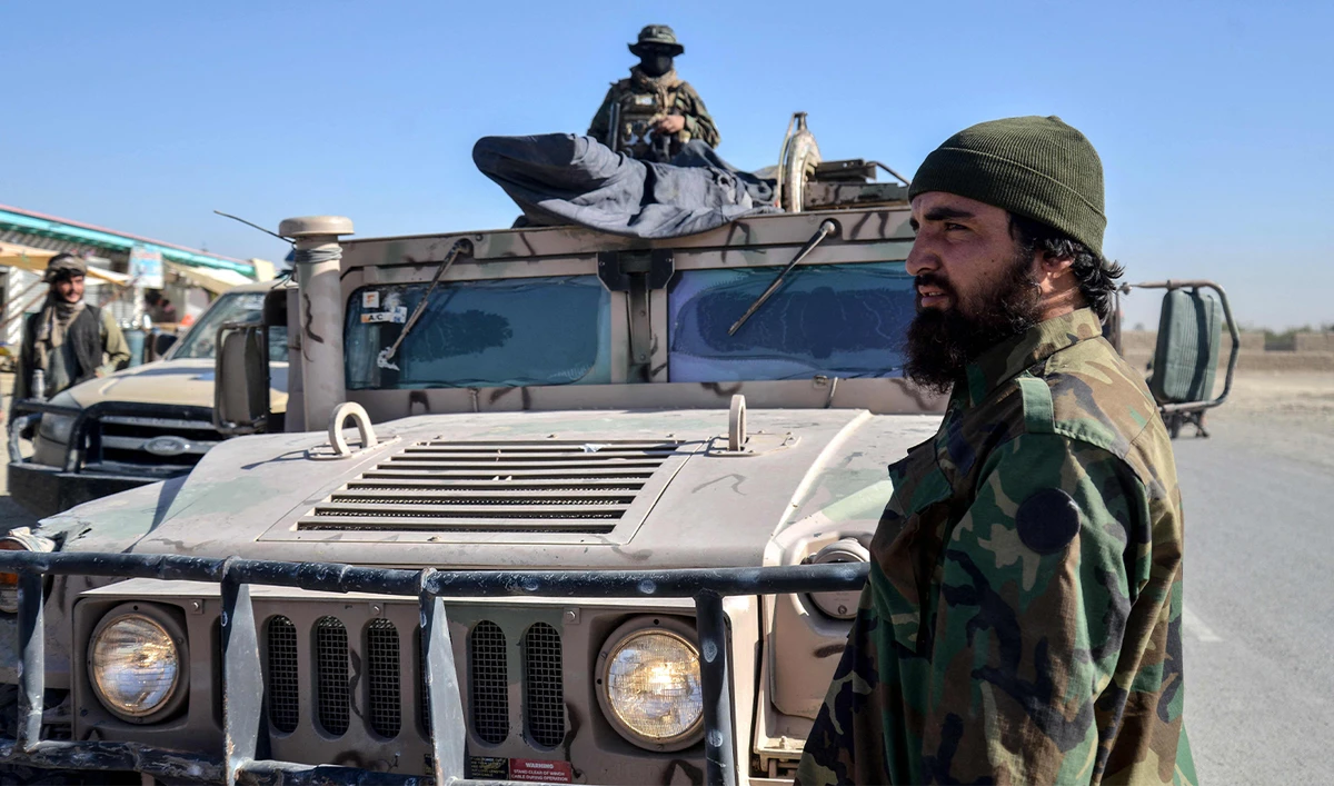 Taliban security personnel patrol on a Humvee in the Shorabak district near the Afghanistan-Pakistan border on October 12, 2025. (AFP)