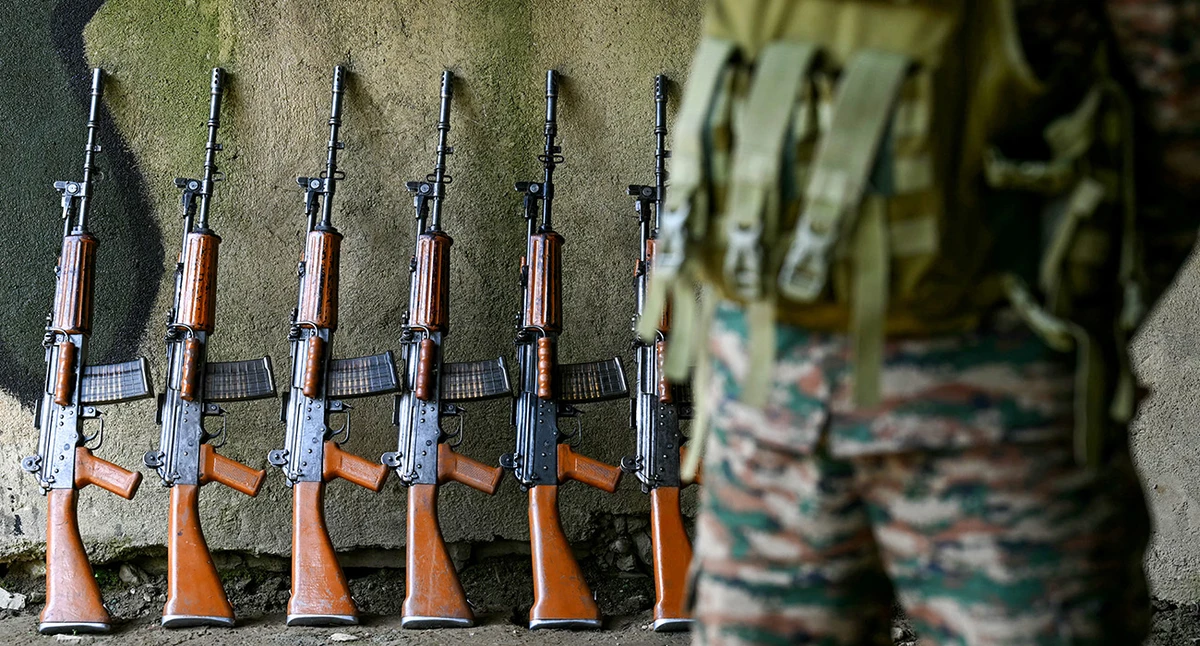Indian army soldiers' rifles are pictured near the Line of Control (LoC) between Pakistan and India in Indian-administered Kashmir on May 20, 2025. (AFP)