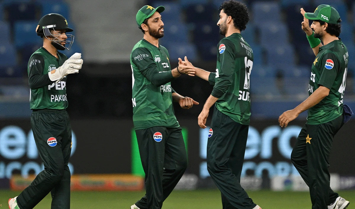 Pakistan's team players celebrates the dismissal of Oman's batsman Hammad Mirza during the Asia Cup 2025 Twenty20 international cricket match between Oman and Pakistan at the Dubai International Stadium in Dubai on September 12, 2025. (AFP/File)