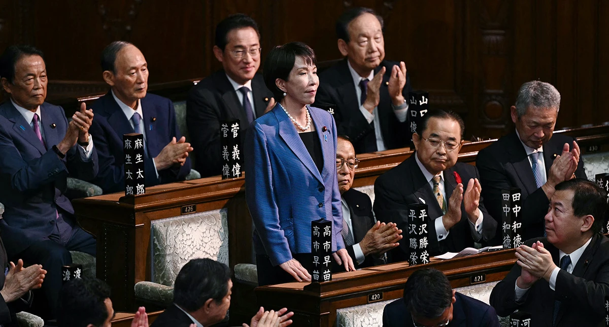 Liberal Democratic Party (LDP) President Sanae Takaichi stands up to acknowledge the applause after she was selected as Japan's new prime minister during an extraordinary session of the lower house of parliament in Tokyo on October 21, 2025. (AFP)