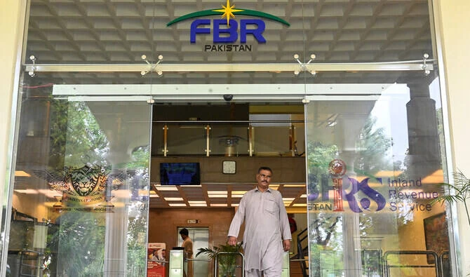 A man walks out of the Federal Board of Revenue (FBR) office in Islamabad on July 4, 2024. (AFP/File)