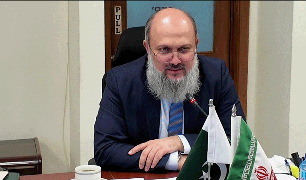 Pakistan's Commerce Minister Jam Kamal Khan in conversation with Iranian Ambassador Reza Amiri-Moghaddam (not in picture) in Islamabad, Pakistan, on November 1, 2025. (Government of Pakistan)