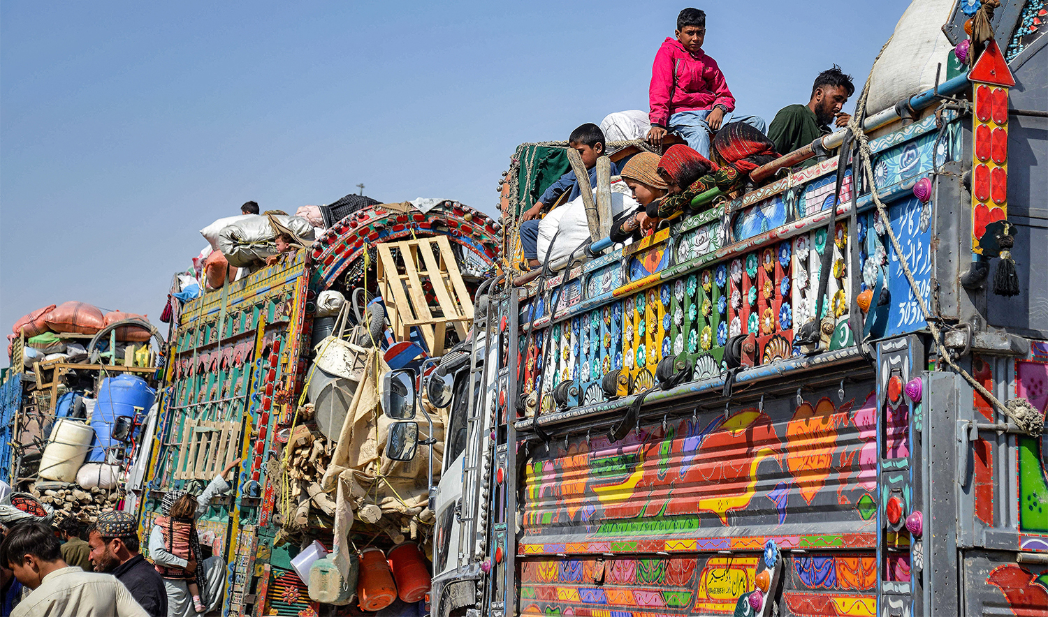 Afghan refugees deported from Pakistan arrive at the zero-point border crossing between Afghanistan and Pakistan, in the Spin Boldak district of Kandahar province on October 27, 2025. (AFP)