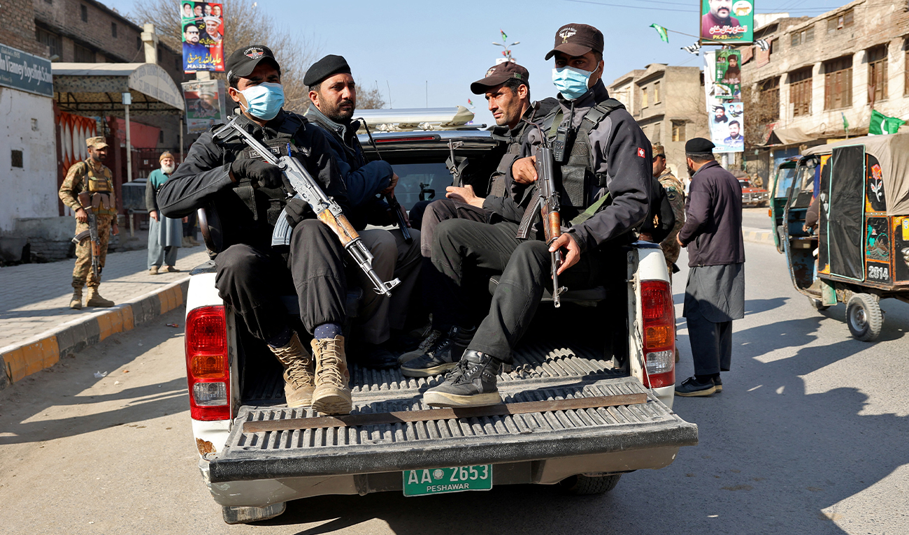 Police officers stand guard in a vehicle in Peshawar, Pakistan, February 8, 2024. (REUTERS/File)