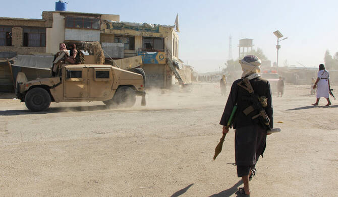 Afghan Taliban fighters patrol near the Afghanistan-Pakistan border in Spin Boldak, Kandahar Province, following exchanges of fire between Pakistani and Afghan forces in Afghanistan, October 15, 2025. (REUTERS)