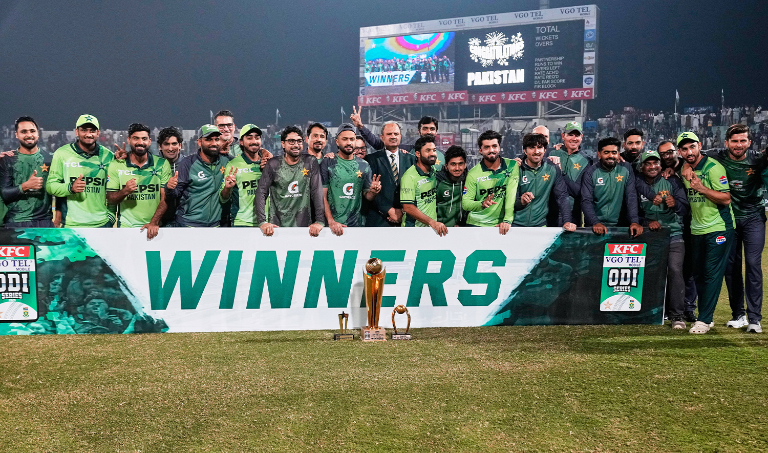 Pakistani players and officials pose for winner trophy on the end of third one day international cricket match between Pakistan and South Africa, in Faisalabad, Pakistan, on Nov. 8, 2025. (AP)
