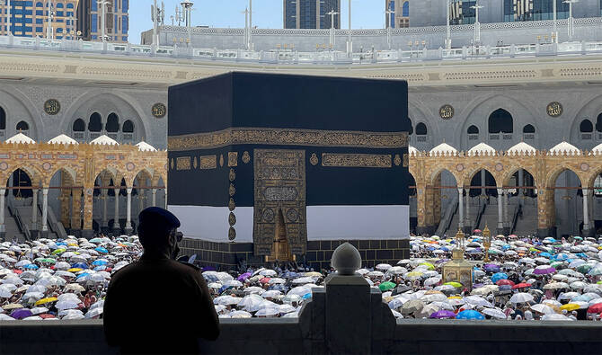 A policeman looks as Muslims perform the farewell Tawaf ritual around the Kaaba at the Grand Mosque in the holy city of Mecca, Saudi Arabia, on June 8, 2025. (REUTERS/File)
