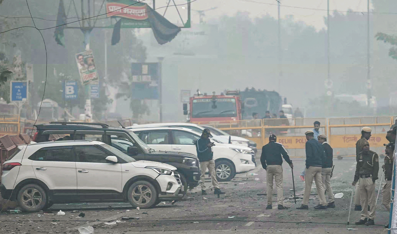 Security personnel check for evidence at the blast site following an explosion near the Red Fort in the old quarters of Delhi on November 11, 2025. (AFP)