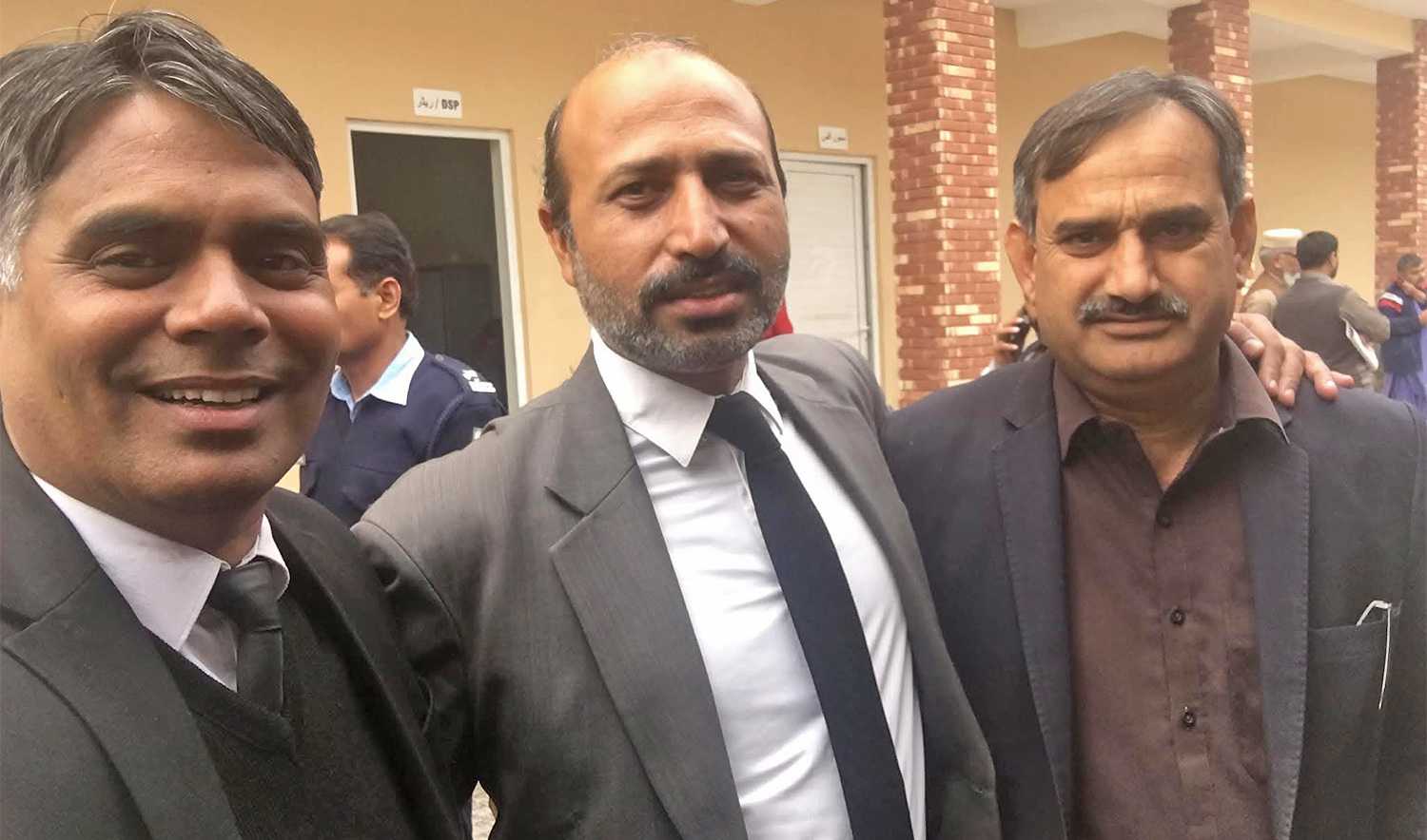 The picture, shared on November 12, 2025, shows lawyer Zubair Ghumman (center), who was killed in a suicide blast outside a district court complex in Islamabad’s G-11 sector on November 11, 2025, standing with his friends. (Aslam Ghumman’s friend)