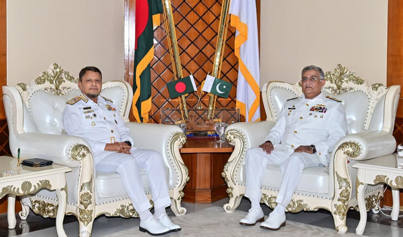 The handout photograph released on November 13, 2025, shows Pakistan’s Chief of Naval Staff, Admiral Naveed Ashraf, meeting Chief of Naval Staff Bangladesh, Admiral M Nazmul Hassan, in Bangladesh. (Facebook/@DgprNavy)