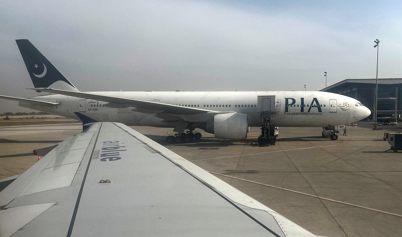 Pakistan International Airlines (PIA) passenger plane sits on tarmac, as seen through a plane window, at the Islamabad International Airport, Islamabad, Pakistan October 27, 2024. (REUTERS/File)