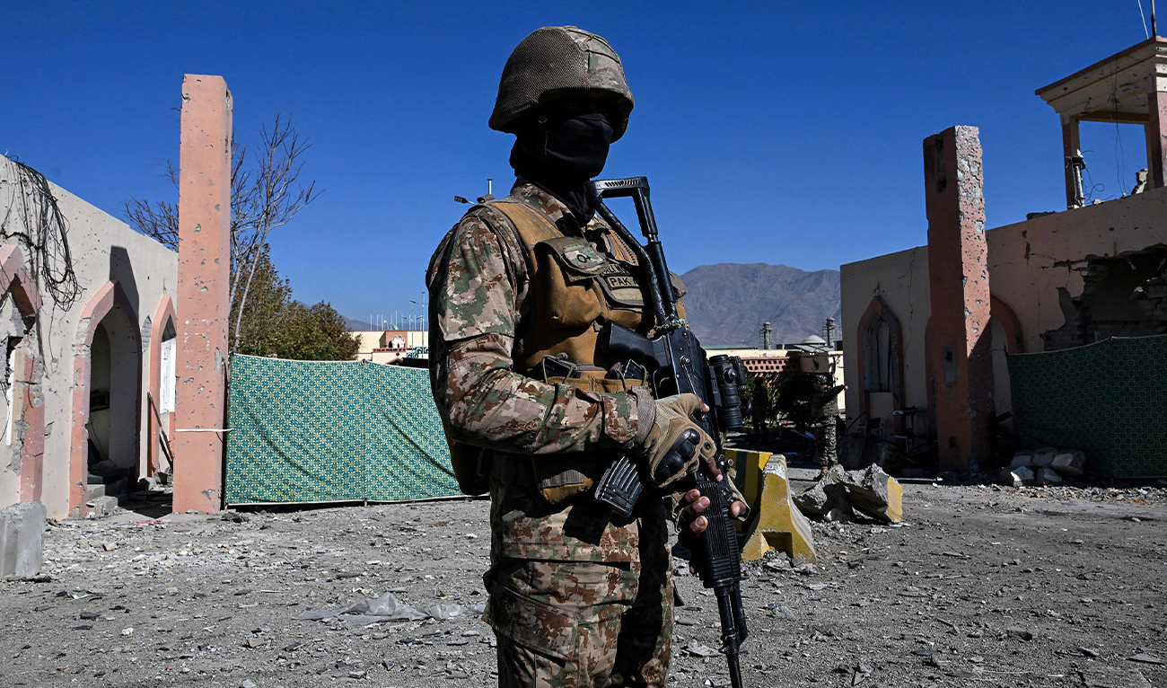 A Pakistani military troop guards outside the damaged entrance after an attack on the Cadet College Wana, a military-linked school, in the South Waziristan district near the Pakistan-Afghanistan border, on November 13, 2025. (AFP/File)