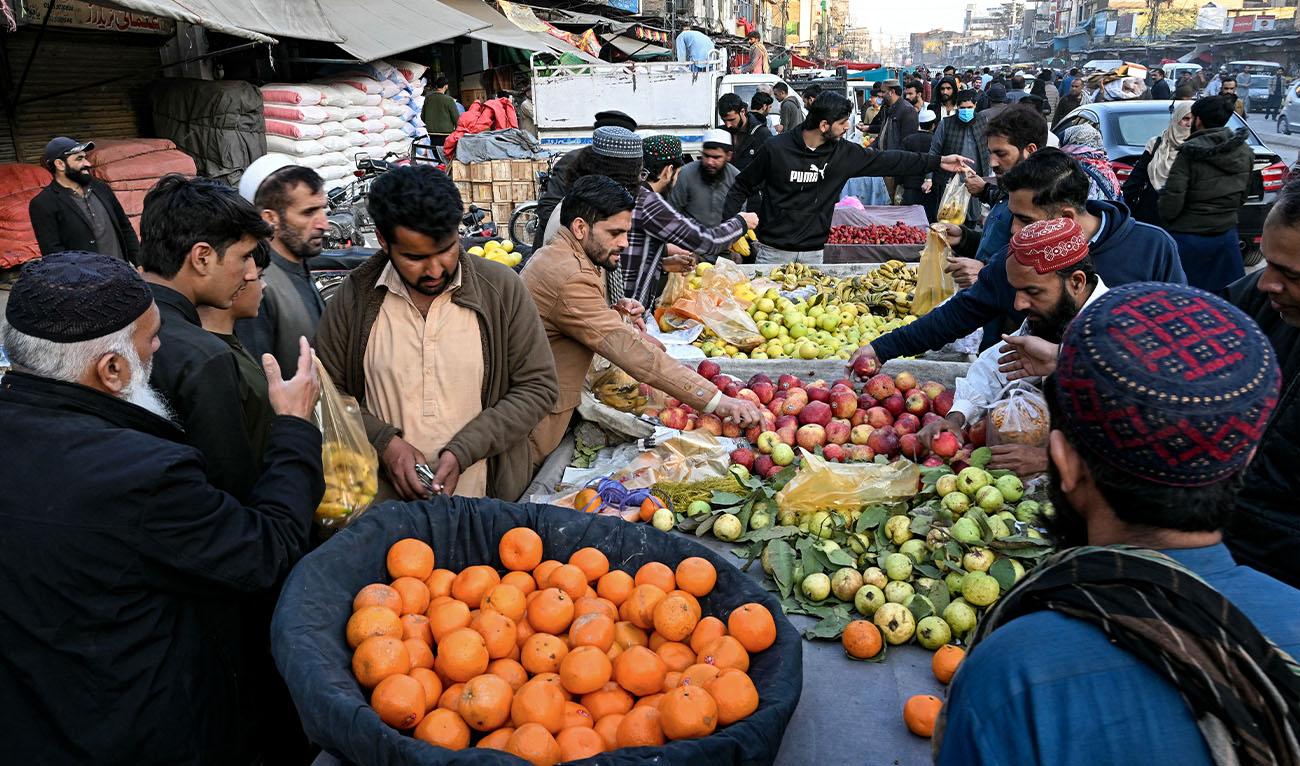 People buy fruits on the first day of the Islamic holy fasting month of Ramadan in Rawalpindi on March 2, 2025. (AFP/ file)