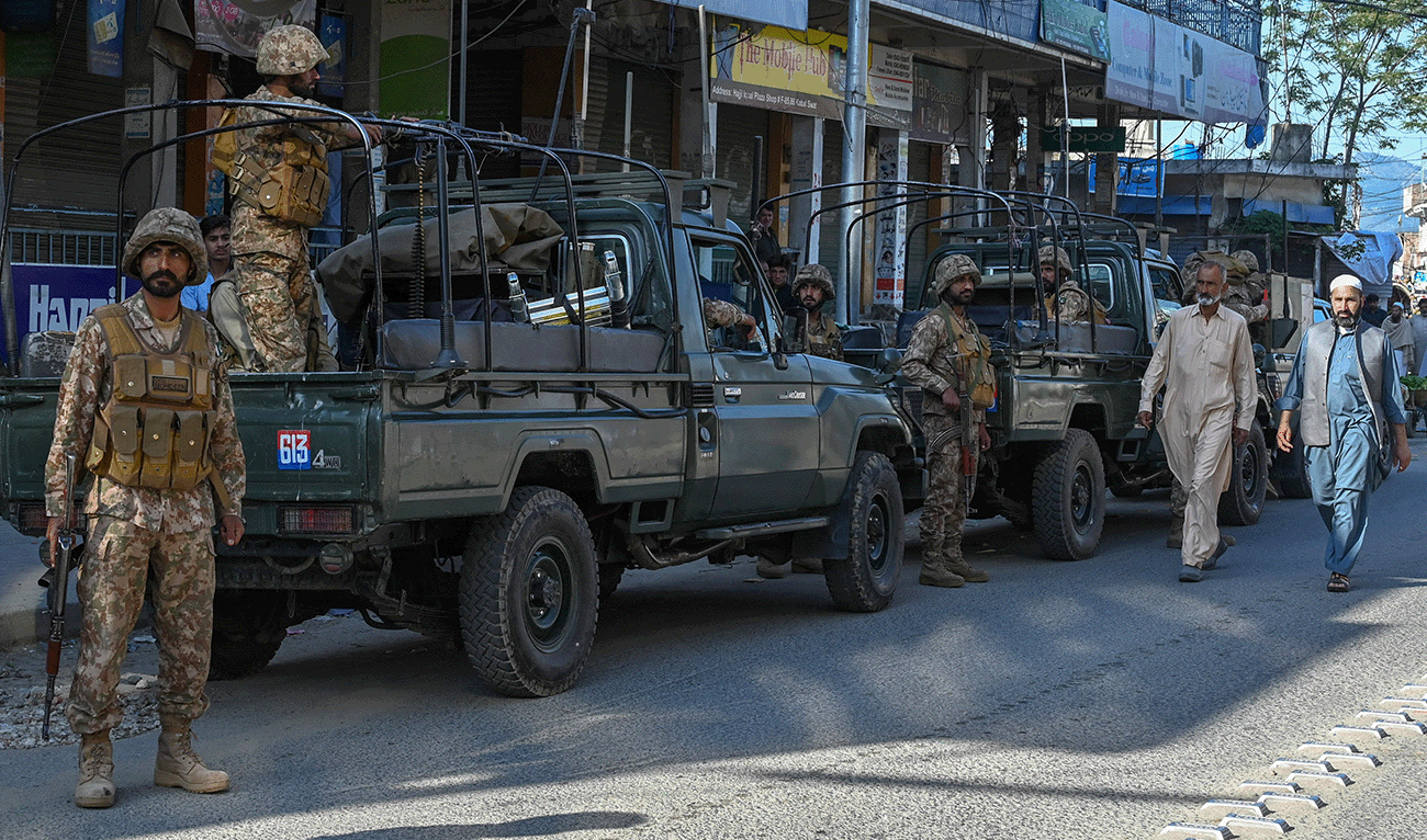 Army troops stand guard along a street in Kabal town of Swat Valley in Pakistan’s northwestern region of Khyber Pakhtunkhwa province on April 25, 2023. (AFP/File)