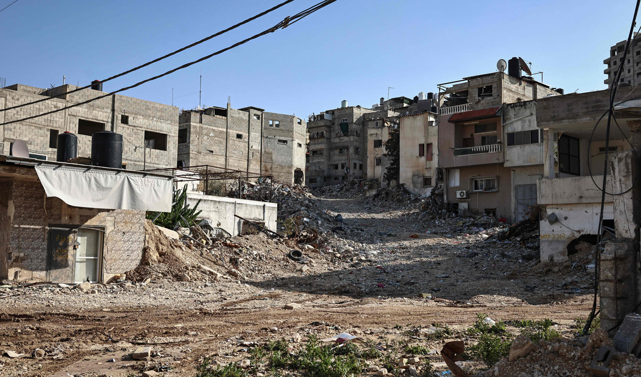 A photograph shows a damaged street in the Nur Shams refugee camp, near Tulkarem in the Israeli-occupied West Bank, on November 18, 2025. (AFP)