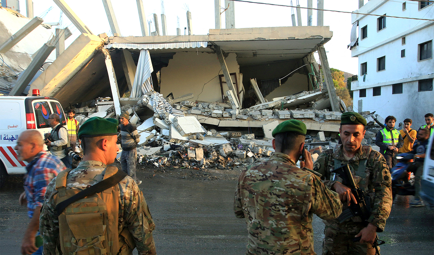 Lebanese army soldiers secure the site of an Israeli airstrike that targeted a building in the southern Lebanese village of Deir Kifa on November 19, 2025. (AFP/File)