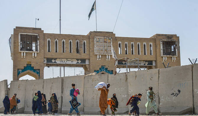 Afghan refugees deported from Pakistan arrive with their belongings at the zero point border crossing between Afghanistan and Pakistan in the Spin Boldak district of Kandahar province on October 19, 2025. (AFP)
