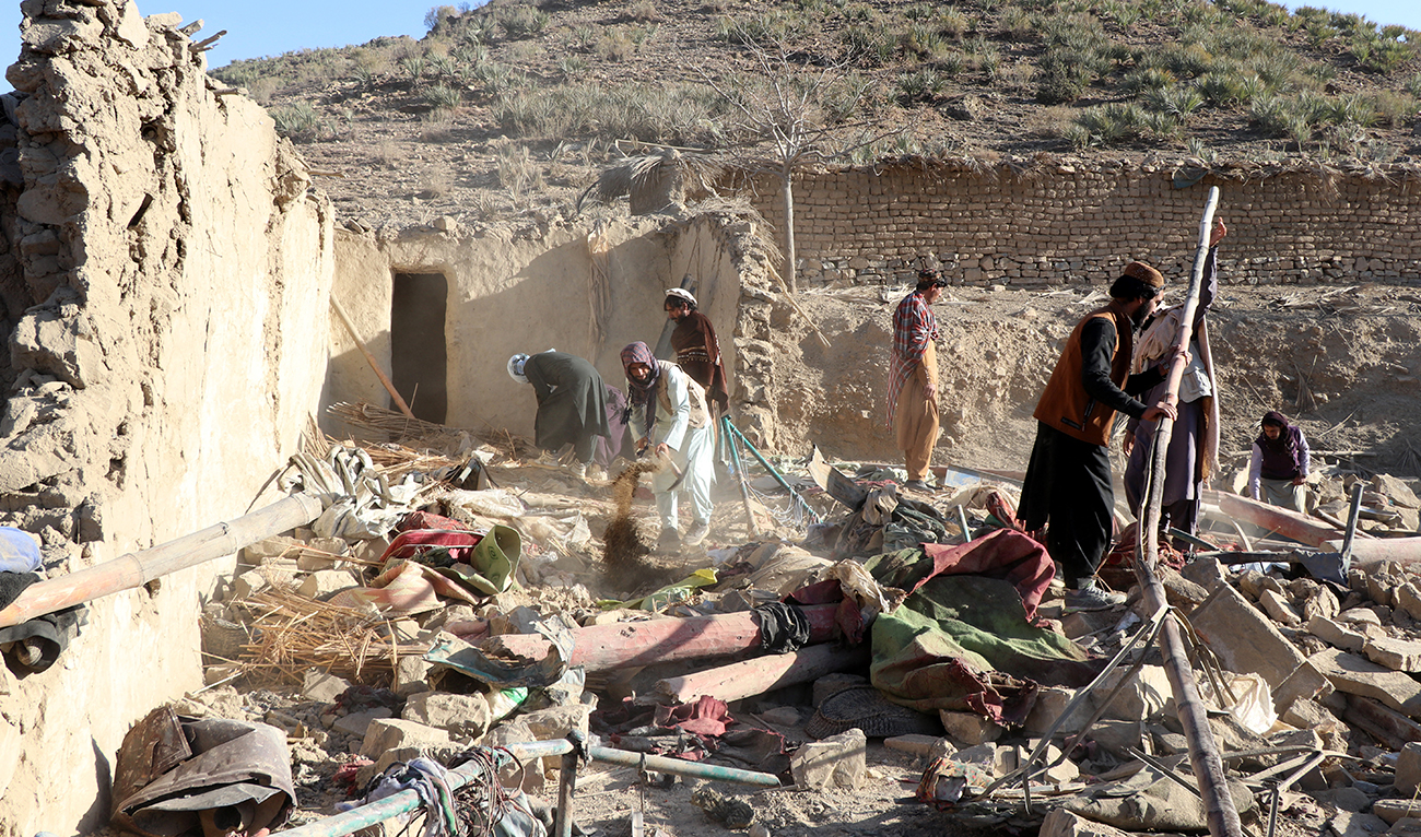 Residents remove debris from a damaged house the Afghan Taliban government said was damaged after Pakistan carried out raids, in Jige Mughalgai in Khost province, Afghanistan, on November 25, 2025. (AFP)