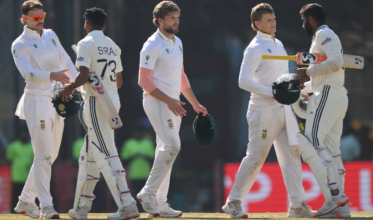 India's Mohammed Siraj and Jasprit Bumrah greet South Africa's players after their win in the end of the fifth day of the second Test cricket match between India and South Africa at the Barsapara Cricket Stadium in Guwahati on November 26, 2025. (AFP)