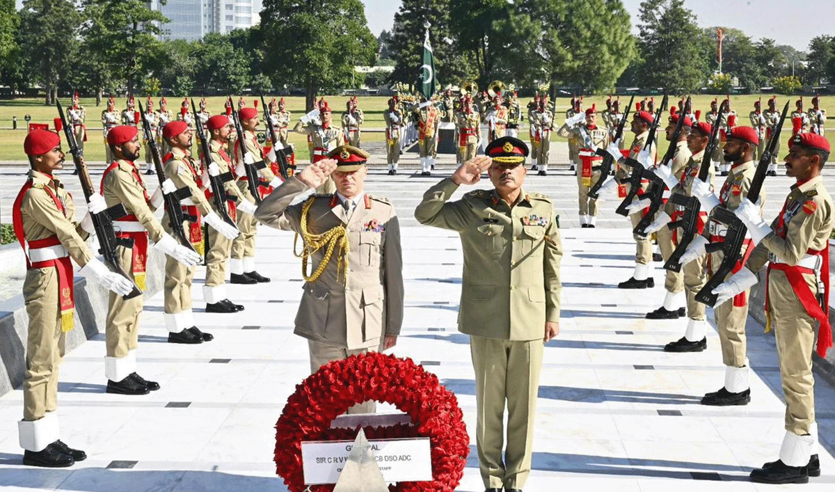 Pakistan's army chief, Field Marshal Asim Munir (front-right) and the United Kingdom's Chief of General Staff, General Sir Charles Roland Vincent Walker laying a flower wreath at the Yadgar-e-Shuhada in GHQ, Rawalpindi, in a picture released by the media wing of the Pakistan Armed Forces on November 6, 2025. (ISPR)